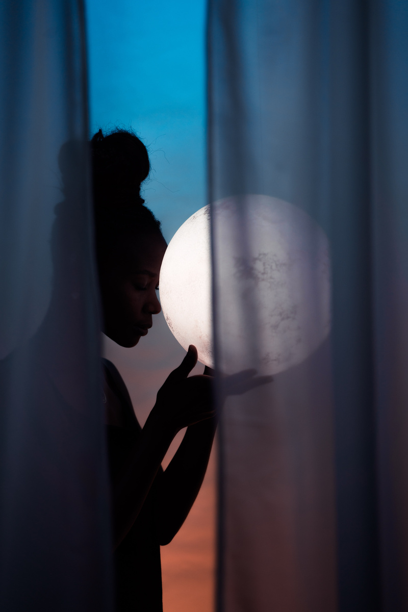 Silhouette of Woman and Full Moon